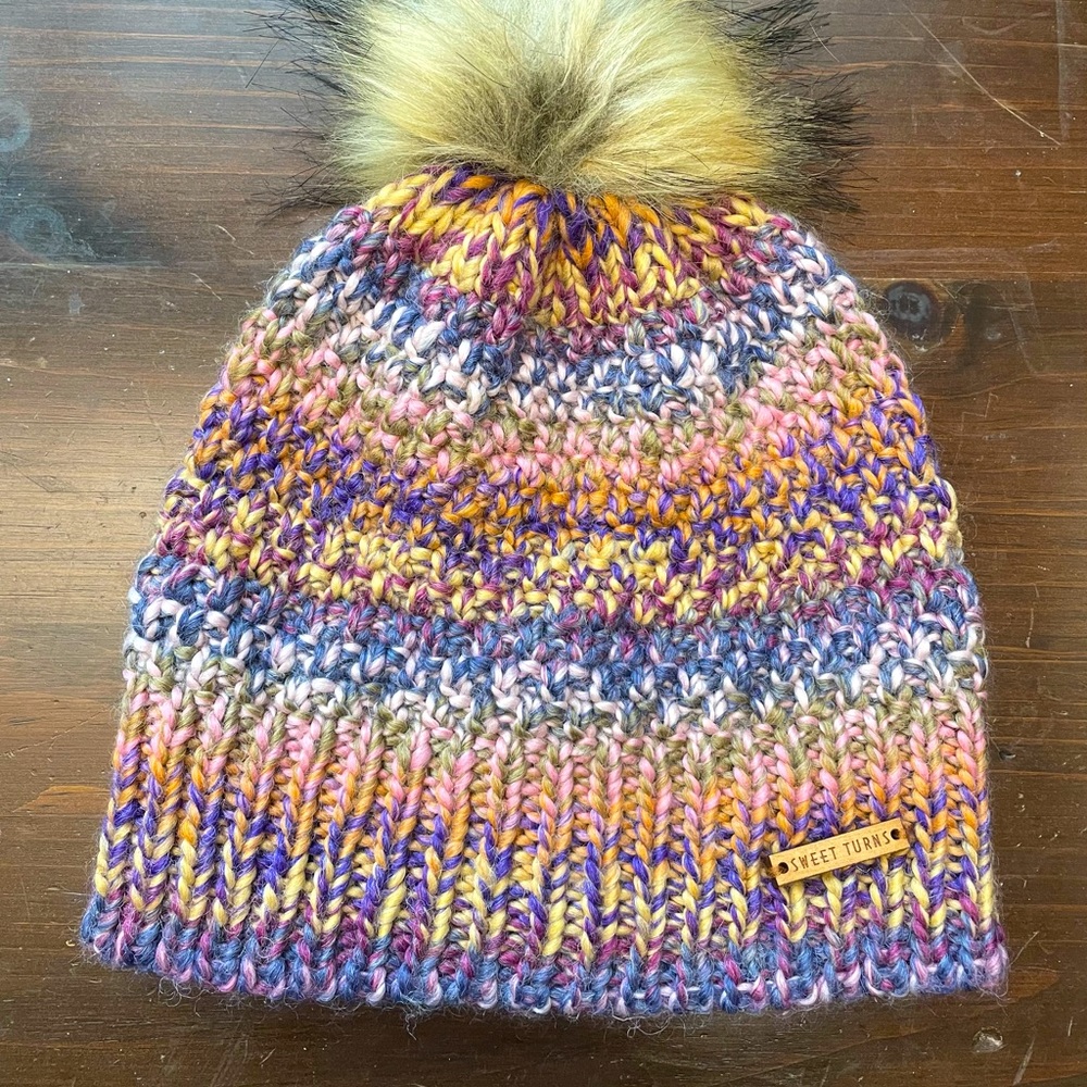 Fun colors make this winter hat stand out as fun & it’ll keep you warm!!! NWOT